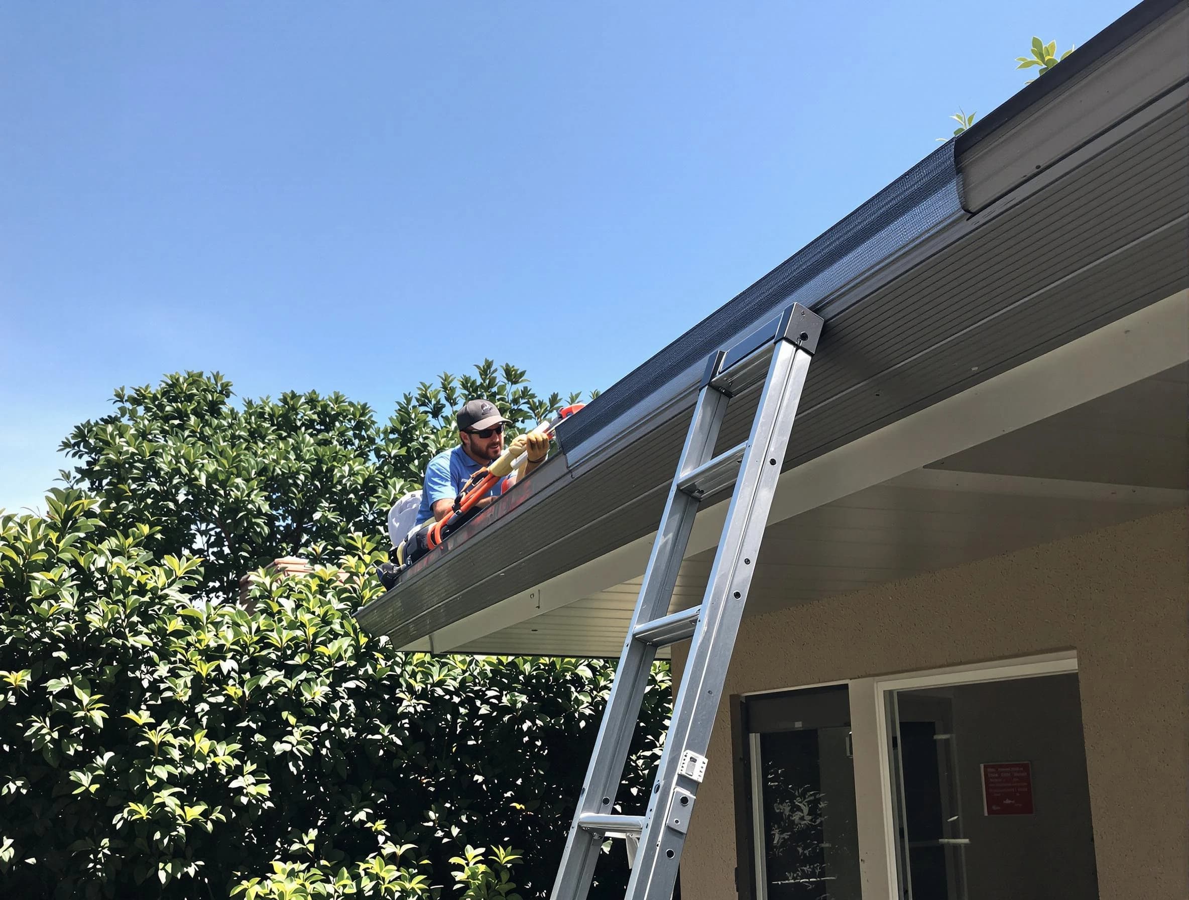 Parma Roofing Company installing gutter guards for a homeowner in Parma, OH