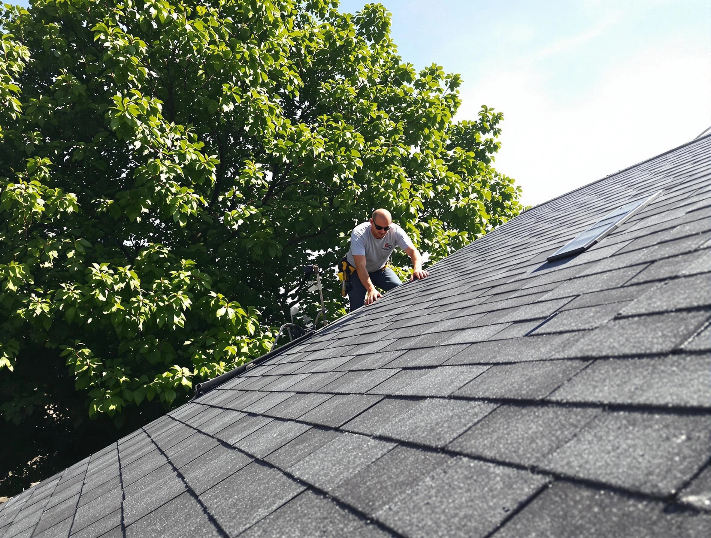 Certified roofers from Parma Roofing Company working in Parma, OH